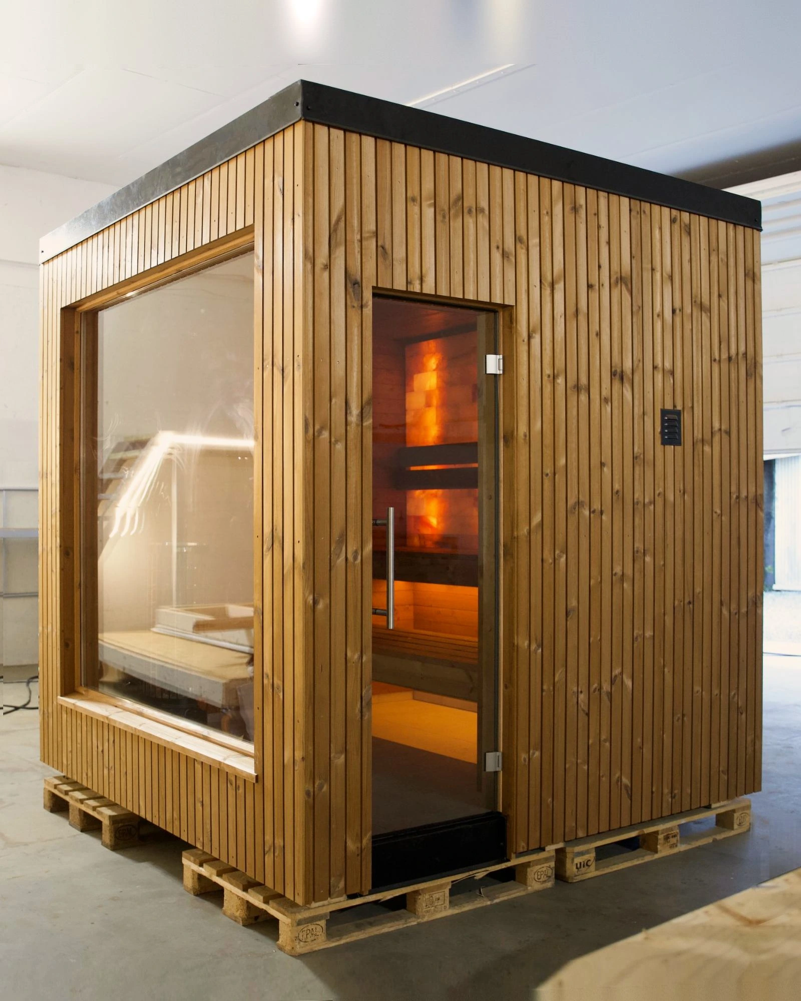 The Cube fully built in the workshop, lit from inside, ready for delivery